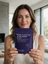 Woman holding a Femjevity Labs Cellular Radiance Booster sachet